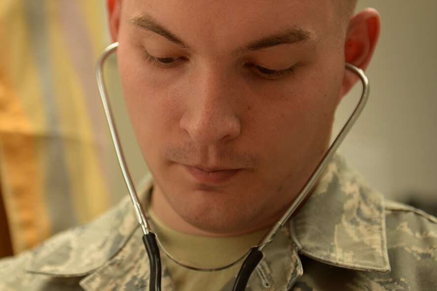 U.S. Air Force Airman 1st Class Samuel Purser, a 52nd Medical Operations Squadron aerospace medical technician from Fayetteville, Ark., takes a patient's blood pressure inside the family health clinic April 22, 2014, at Spangdahlem Air Base, Germany. Members of the family health clinic see more than 20 patients a day. (U.S. Air Force photo by Senior Airman Rusty Frank/Released)