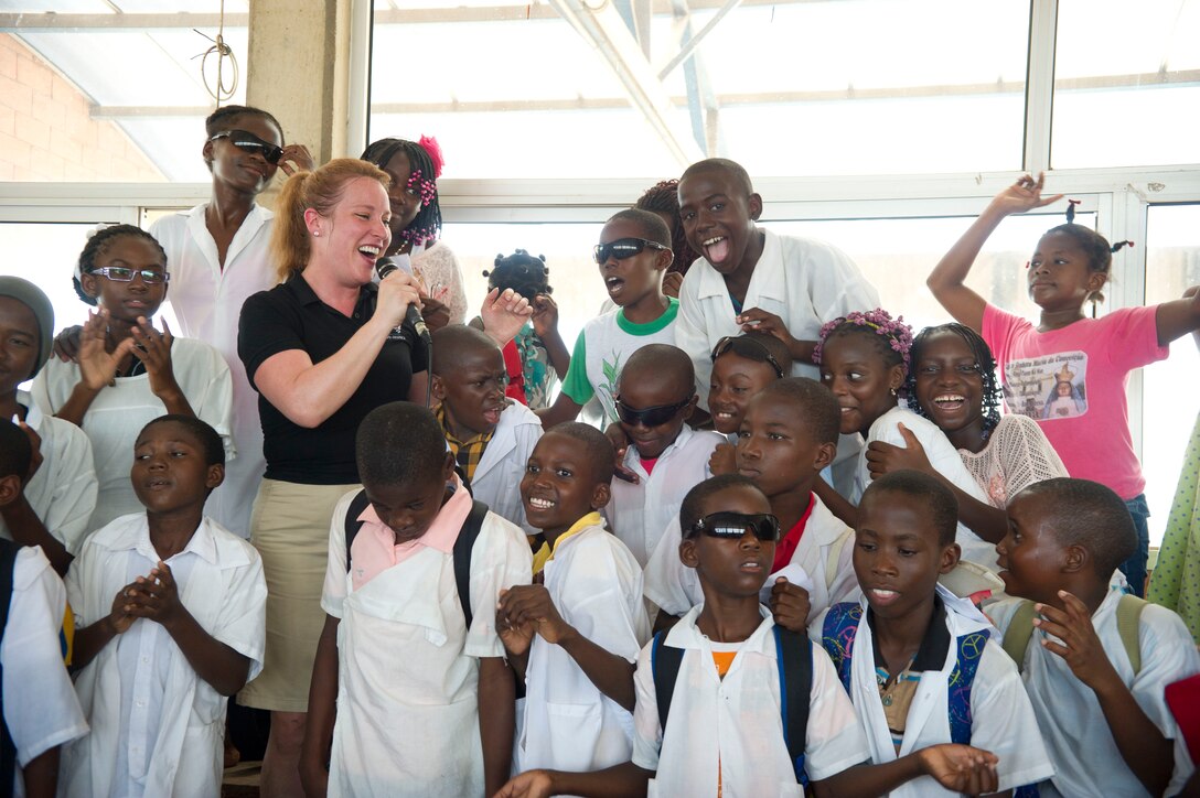 Staff Sgt. Jill Diem sings with the U.S. Air Forces in Europe Band ensemble Touch n' Go at the Dom Bosco School in Luanda, Angola, March 26, 2014. The band is in Angola as part of African Partnership Flight Angola 2014, which is an event providing a collaborative learning environment for the Angolan, U.S. and Zambian air forces. (U.S. Air Force photo/Tech. Sgt. Benjamin Wilson)(Released)