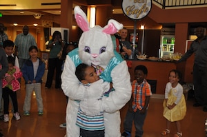 A very egg-stra special guest hugs 5-year old Preston Reid, son of Petty Officer 1st Class Scott Reid, Naval Health Clinic Charleston Dental leading petty officer during an Easter celebration April 19, 2014, at NHCC. (U.S. Navy photo/Petty Officer 3rd Class Caralyn Mulyk)