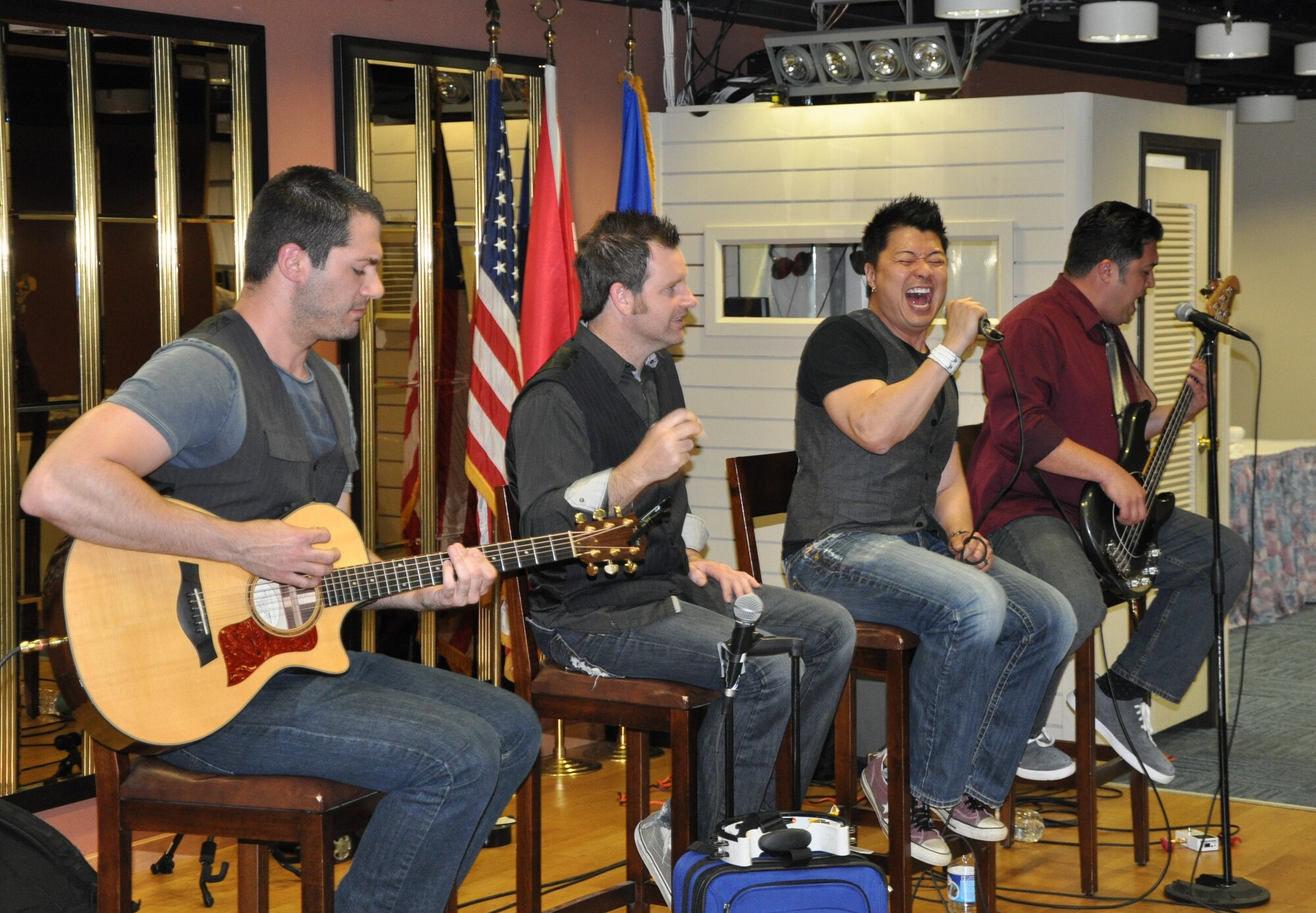 Alternative pop and rock band Adam’s Attic performs at the Izmir Club April 21, 2014. The band,  composed of guitarist (left)  Frank DeSalvo, drummer Scott Boaz, singer and song writer Joe Henry and bass guitarist Derek Henry performed at Izmir as part of an Armed Forces Entertainment tour for military installations overseas. (U.S. Air Force photo by Tanju Varlikli