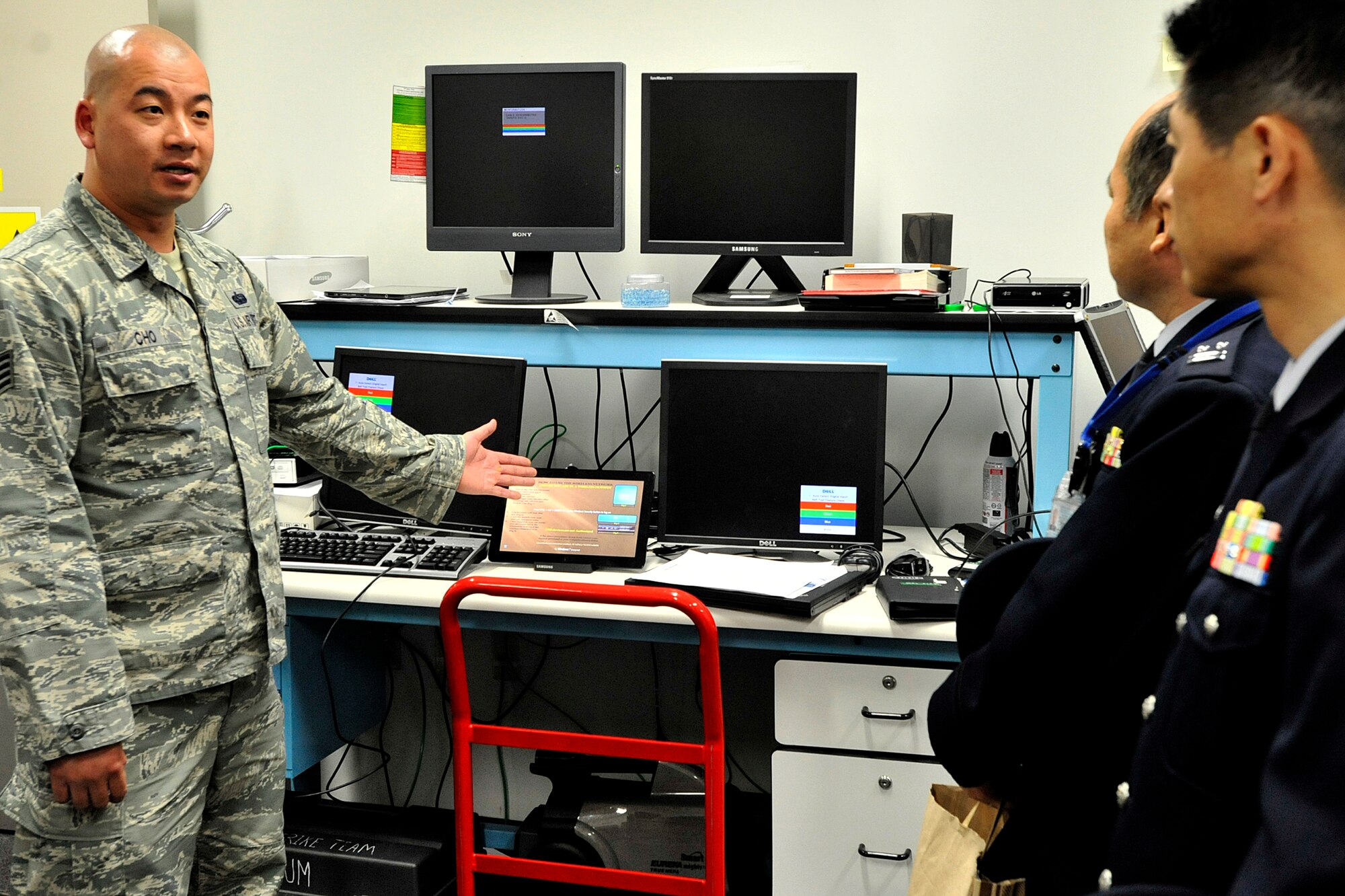 MISAWA AIR BASE, Japan – U.S. Air Force Staff Sgt. Soloman Cho, 35th Communication Squadron NCO in charge of client system technicians, explains how his section troubleshoots and repairs computers to Japan Air Self-Defense Force Col. Kazuhiko Yoshimura, communications and computer security evaluation group commander, and Lt. Col. Hiroya Asasda, communications evaluation squadron commander, during a tour of the 35 CS at Misawa Air Base, Japan, April 22, 2014. The JASDF commanders were interested in how the 35 CS detects and defends the base’s infrastructure from malware and malicious intent.  (U.S. Air Force photo/Staff Sgt. Tong Duong)