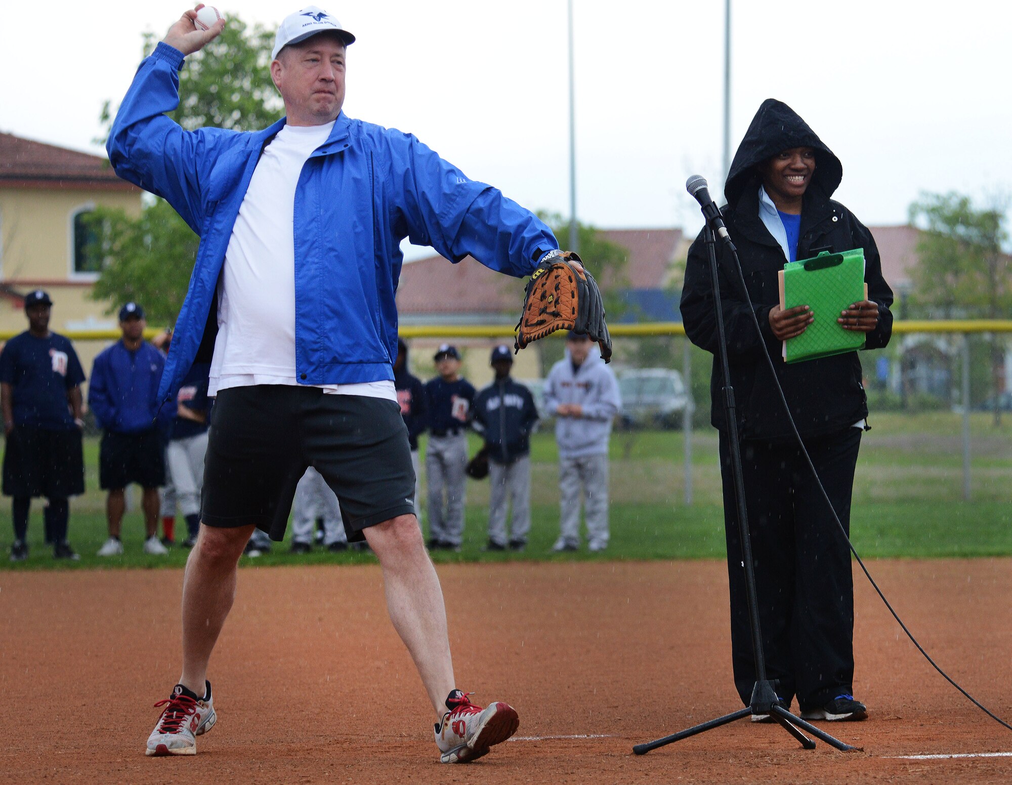 Brig. Gen. Jon Norman, 31st Fighter Wing commander, and Trashanda Gess, 31st Force Support Squadron AYP sports coordinator, pitch the first baseball to kick-off the “Baseball Blast-off” event, April 19, 2014, at Aviano Air Base, Italy. The event kicked-off the Aviano Youth Program summer sport season offered to children and teenagers between the ages of 3-18 years old. (U.S. Air Force photo/Airman 1st Class Deana Heitzman)    