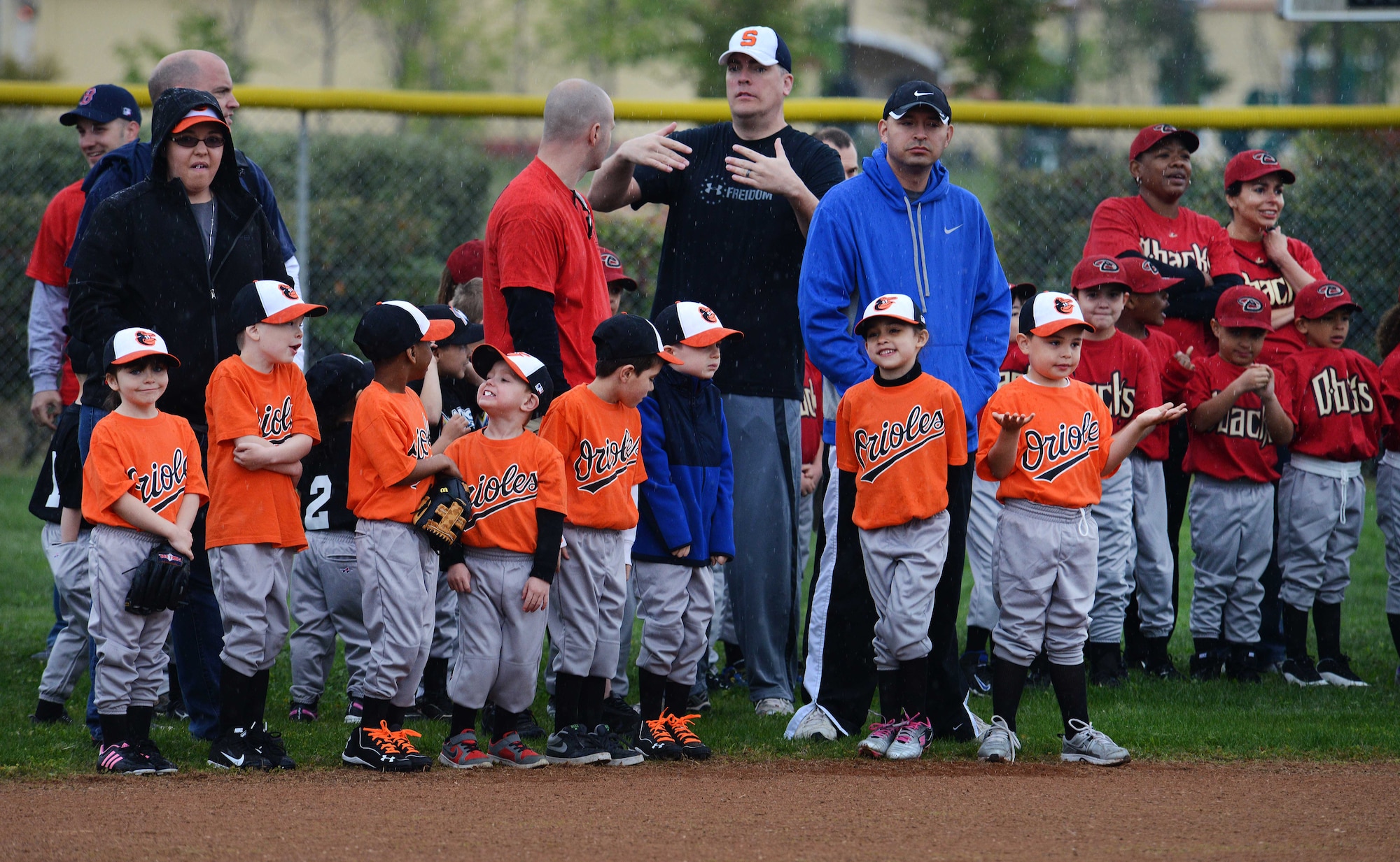 Children from the Aviano Youth Program baseball teams line up to be introduced at the “Baseball Blast-off” event, April 19, 2014, at Aviano Air Base, Italy. The AYP offers many sporting opportunities for children and teenagers between the ages of 3-18 years old throughout the year. Children also have the opportunity to travel to Vicenza to compete. (U.S. Air Force photo/Airman 1st Class Deana Heitzman)   