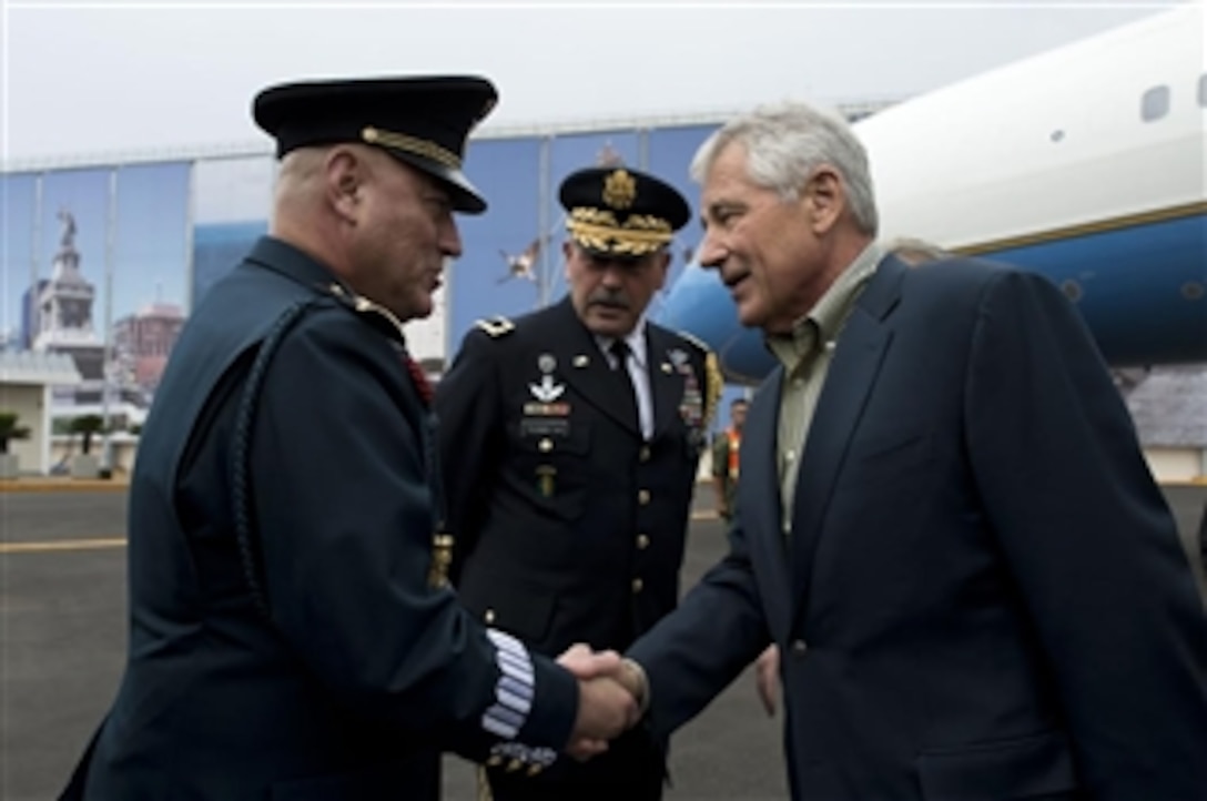 U.S. Defense Secretary Chuck Hagel greets Mexican Brig. Gen. Uriel Rios as U.S. Army Maj. Gen. Simeon G. Trombitas, senior defense official in Mexico, looks on upon Hagel's arrival in Mexico City, April 23, 2014. Rios is a liaison officer to the Mexican secretariat of national defense. Hagel will attend a defense ministerial conference with Mexico, Canada and the United States before traveling to Guatemala. Earlier in the day, Hagel toured Fort Bragg, N.C. Earlier in the day, Hagel toured Fort Bragg, N.C., meeting with special operations personnel.