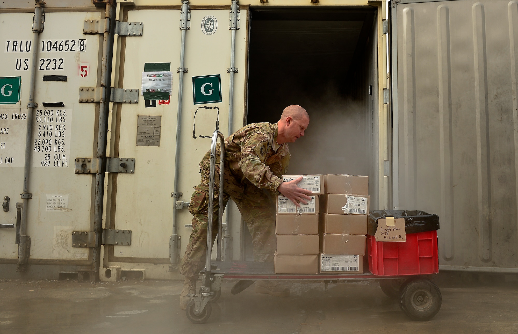 Master Sgt. Patrick Noppenberg organizes lunch food items March 15, 2014 at Kandahar Air Field, Afghanistan. Noppenberg is a 466th Air Expeditionary Squadron noncommissioned officer in charge of food services and responsible for ordering food, receiving and restocking supplies for a kitchen that provides about 1500 meals a day for personnel assigned to Kandahar Air Field. The Dallas, Texas, native is deployed from the 7th Force Support Squadron, Dyess Air Force Base, Texas. (U.S. Air Force photo/Staff Sgt. Vernon Young Jr.) 


