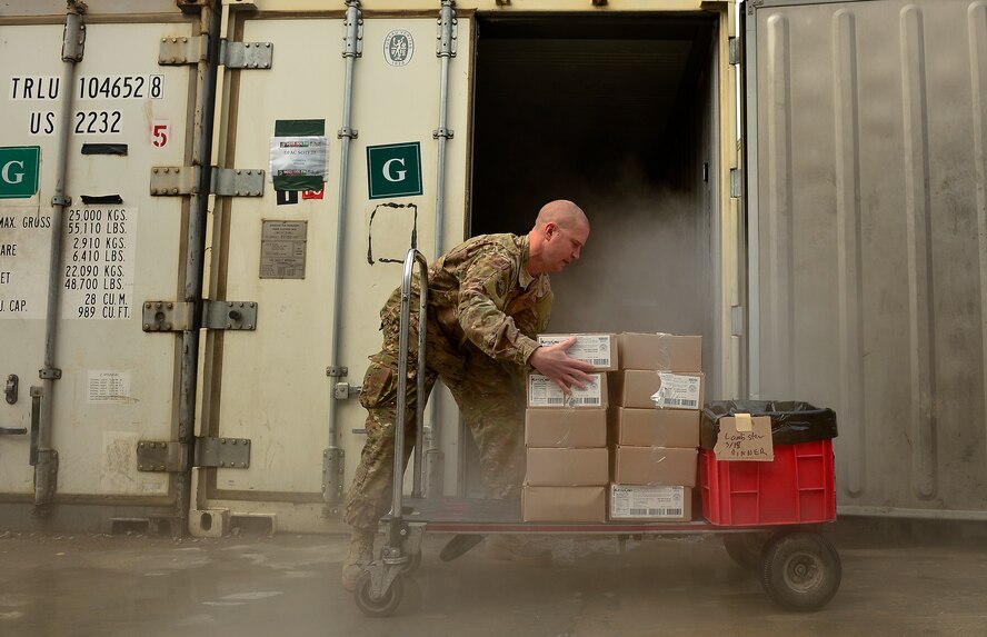 Master Sgt. Patrick Noppenberg organizes food items March 15, 2014 at Kandahar Air Field, Afghanistan. Noppenberg is a 466th Air Expeditionary Squadron noncommissioned officer in charge of food services and is responsible for ordering food and receiving and restocking supplies for a kitchen that provides about 1500 meals a day for personnel assigned to Kandahar Air Field. (U.S. Air Force photo/Staff Sgt. Vernon Young Jr.) 