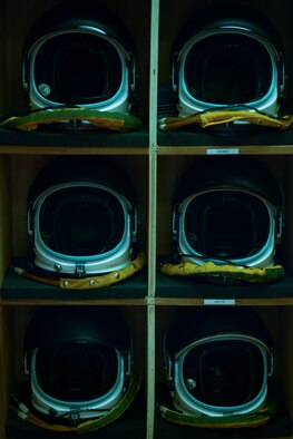 Full pressure suit helmets sit in the aircrew locker room at the 99th Expeditionary Reconnaissance Squadron April 20, 2014, at a flightline in Southwest Asia. The helmets, unique to the U-2, are the only ones in the Air Force capable of sustaining pilots during high-altitude flight. (U.S. Air Force photo/Tech. Sgt. Russ Scalf)