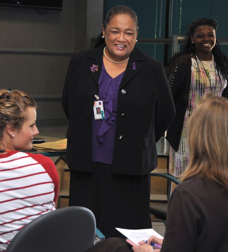 Angela P. Morton, Huntsville Center's Equal Employment Opportunity (EEO) chief, learns about new employees as she leads EEO training for new hires in April 2014. Stephanie Caldwell, in the background, is the center's EEO complaints manager.