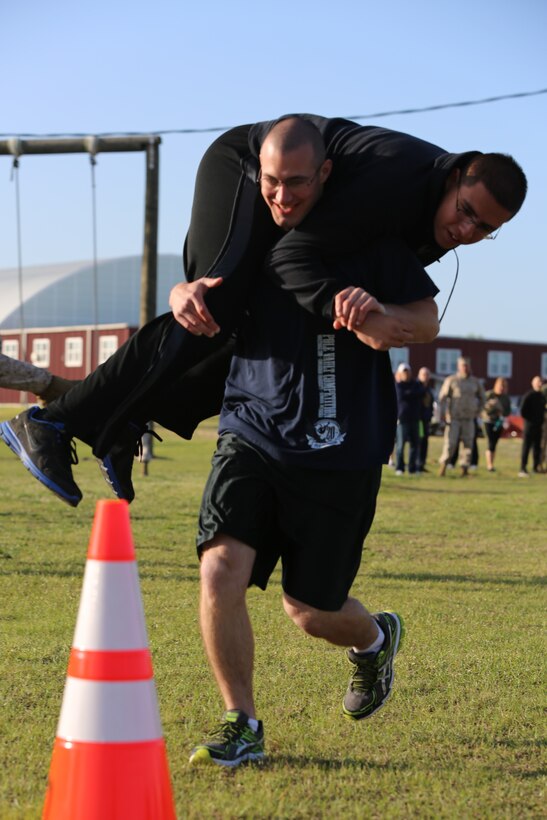 Lance Cpl. Dustin Parsons carries Lance Cpl. Nick Passopulo during a fireman carry relay race at Marine Corps Air Station Cherry Point, N.C., April 18, 2014. Parsons and Passopulo are chemical, biological, radiological and nuclear defense specialists with MWHS-2.


