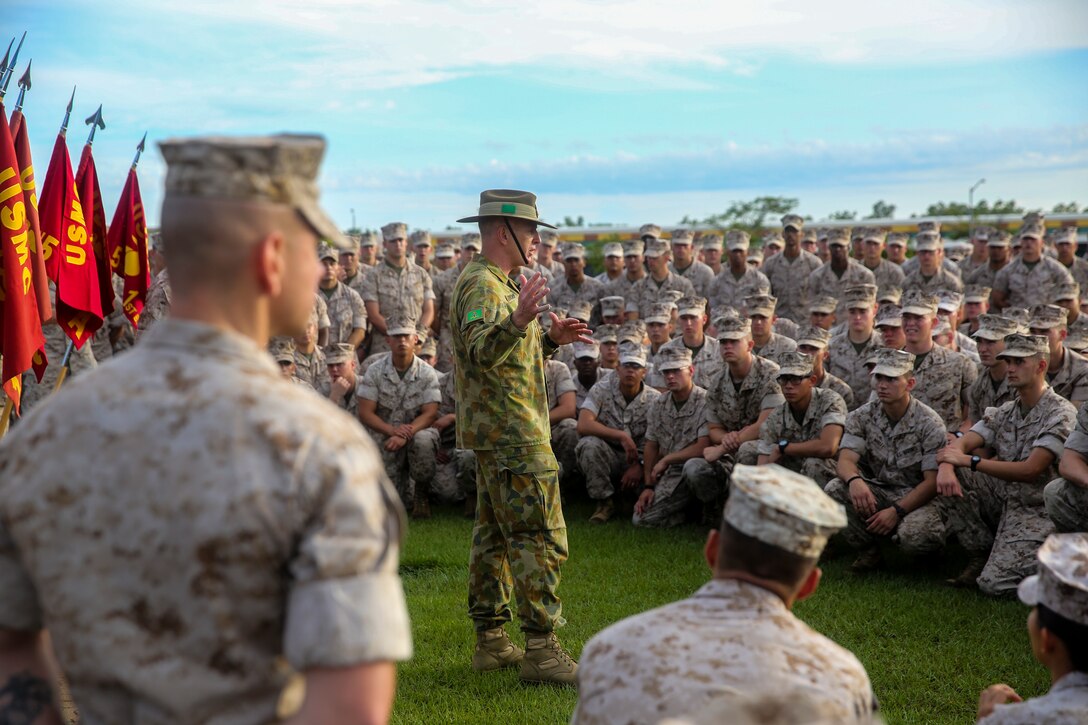 Marines with Marine Rotational Force – Darwin form around Brig. Gen. John Frewen, 1st Brigade commanding general and senior Australian Defence Force officer for Robertson Barracks, to listen to him speak about the six-month rotation, expectations and the significance of their presence, April 11. Frewen said the rotation is a tangible sign of the strength between Australia and the United States.