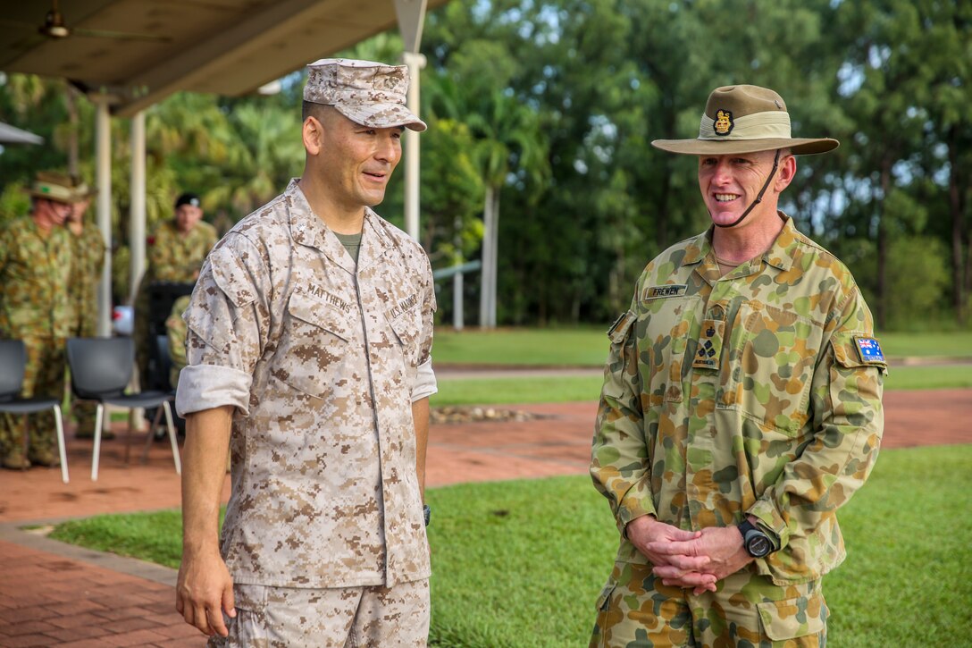 Lt. Col. Keven Matthews, commanding officer of Marine Rotational Force – Darwin, and Brig. Gen. John Frewen, 1st Brigade commanding general and senior Australian Defence Force officer for Robertson Barracks, talk with each other after Frewen addresses the Marines of MRF-D about expectations for the rotation, April 11. Frewen said the rotation is a tangible sign of the strength between Australia and the United States.
