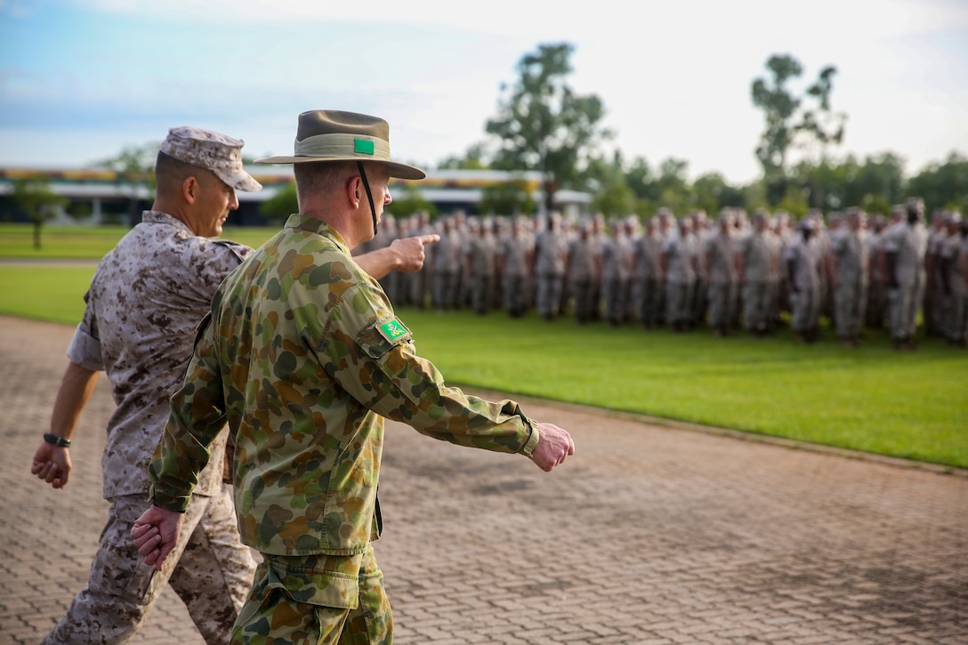 Lt. Col. Keven Matthews, commanding officer of Marine Rotational Force – Darwin, and Brig. Gen. John Frewen, 1st Brigade commanding general and senior Australian Defence Force officer for Robertson Barracks, approach the battalion together before Frewen addresses MRF-D Marines about the six-month rotation, expectations and the significance of their presence, April 11. Frewen said the rotation is a tangible sign of the strength between Australia and the United States.



