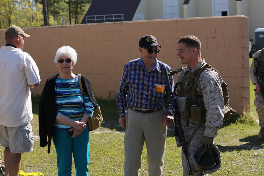 Marines with 2nd Battalion, 6th Marine Regiment, took the time to visit with veterans during World War II Day aboard Marine Corps Base Camp Lejeune, N.C., April 24, 2014. World War II veterans shared their stories and viewed static displays of gear Marines are using in combat today.