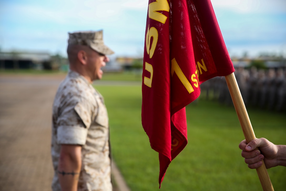 Sgt. Maj. Rogelio De Leon, sergeant major of Marine Rotational Force – Darwin, calls his Marines to attention to listen to Brig. Gen. John Frewen, 1st Brigade commanding general and senior Australian Defence Force officer for Robertson Barracks, speak about the six-month rotation, expectations and the significance of their presence, April 11. Frewen said the rotation is a tangible sign of the strength between Australia and the United States.