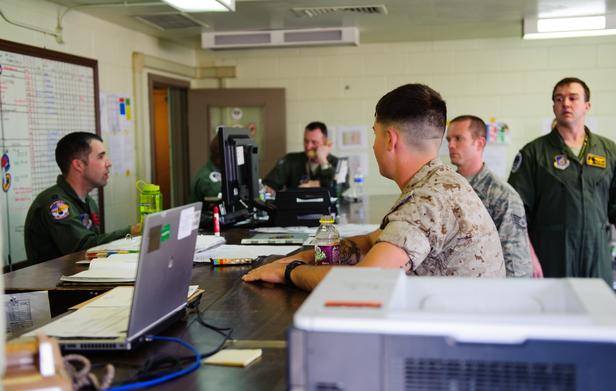 Airmen and Marines collaborate flying schedules to ensure a mission ready status for pilots and jets during Max Thunder at Gwangju Air Base, Republic of Korea, April 22, 2014. More than 600 Department of Defense personnel participated in the 12th Max Thunder to develop and ensure bilateral aerial training for Airmen from the ROK and various U.S. branches. (U.S. Air Force photo by Senior Airman Armando A. Schwier-Morales/Released)