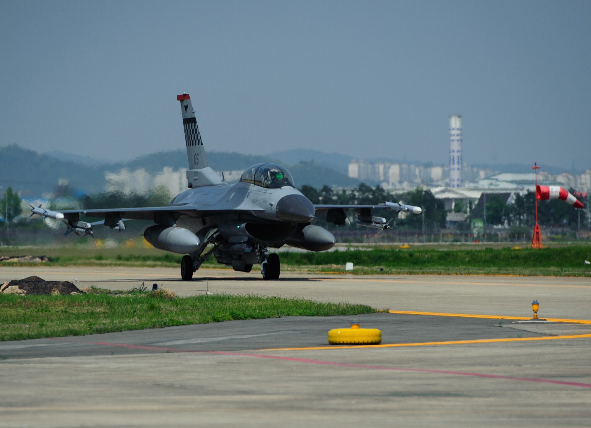 An Osan Air Base, Republic of Korea,  F-16 Fighting Falcon taxis after a sortie during Max Thunder at Gwangju Air Base, ROK, April 22, 2014. The two-week exercise is the air component-led portion of Exercise Foal Eagle and trains both ROK and U.S. Airmen on aerial training. (U.S. Air Force photo by Senior Airman Armando A. Schwier-Morales/Released)