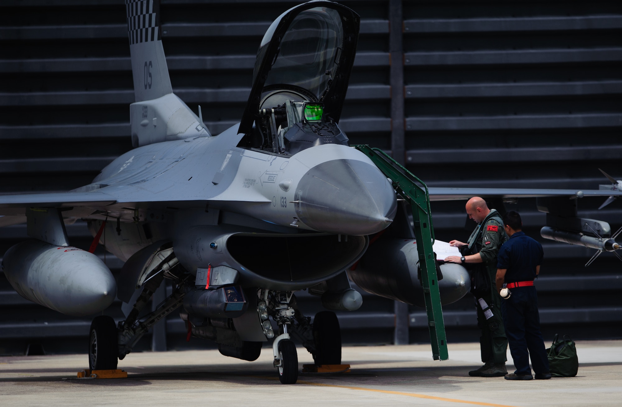 Airmen ready an Osan Air Base, Republic of Korea, F-16 Fighting Falcon for a sortie during Max Thunder at Gwangju Air Base, ROK, April 22, 2014. The two-week exercise is the air component-led portion of Exercise Foal Eagle and trains both ROK and U.S. Airmen on aerial training. (U.S. Air Force photo by Senior Airman Armando A. Schwier-Morales/Released)