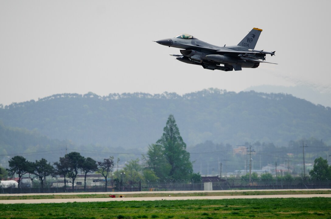 An 80th Fighter Squadron F-16 Fighting Falcon takes off for a sortie during the 12th Max Thunder at Gwangju Air Base, Republic of Korea, April 22, 2014. The two-week exercise is the air component-led portion of Exercise Foal Eagle and trains both ROK and U.S. Airmen on aerial training. (U.S. Air Force photo by Senior Airman Armando A. Schwier-Morales/Released)
