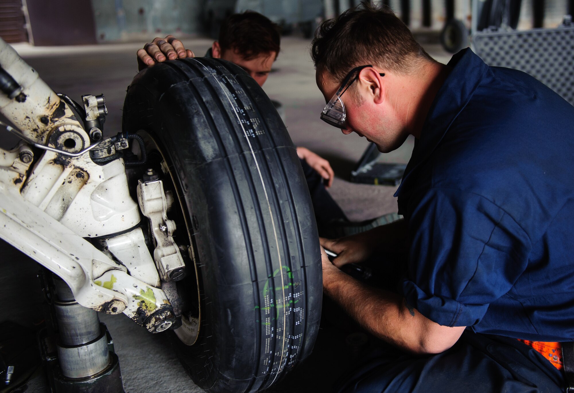 Staff Sgt. Matthew Golitko, 80th Maintenance Unit crew chief, changes a tire of an F-16 Fighting Falcon during Max Thunder at Gwangju Air Base, Republic of Korea, April 22, 2014. More than 600 Department of Defense personnel participated in the 12th Max Thunder to develop and ensure bilateral aerial training for Airmen from the ROK and various U.S. branches. (U.S. Air Force photo by Senior Airman Armando A. Schwier-Morales/Released)