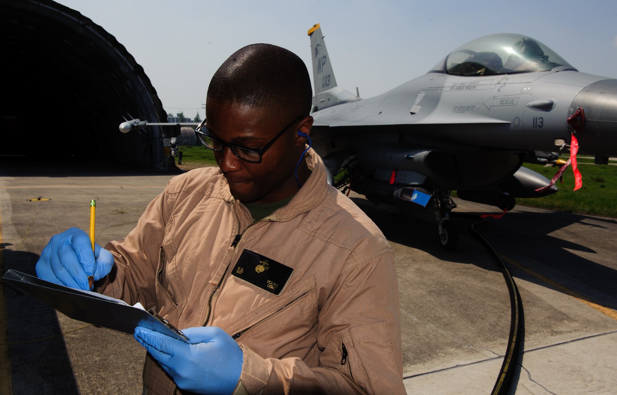 U.S. Marine Corps Sgt. Keith Young, 171 Air Operations boat fuels, refuels  an 80th Fighter Squadron F-16 Fighting Falcon during the Joint Coalition exercise Max Thunder  at Gwangju Air Base, ROK, April 22, 2014. The two week exercise is the Air Component-led portion of Exercise Foal Eagle and trains both ROK and U.S. Airmen bi-lateral aerial training. (U.S. Air Force photo by Senior Airman Armando A. Schwier-Morales/Released)
