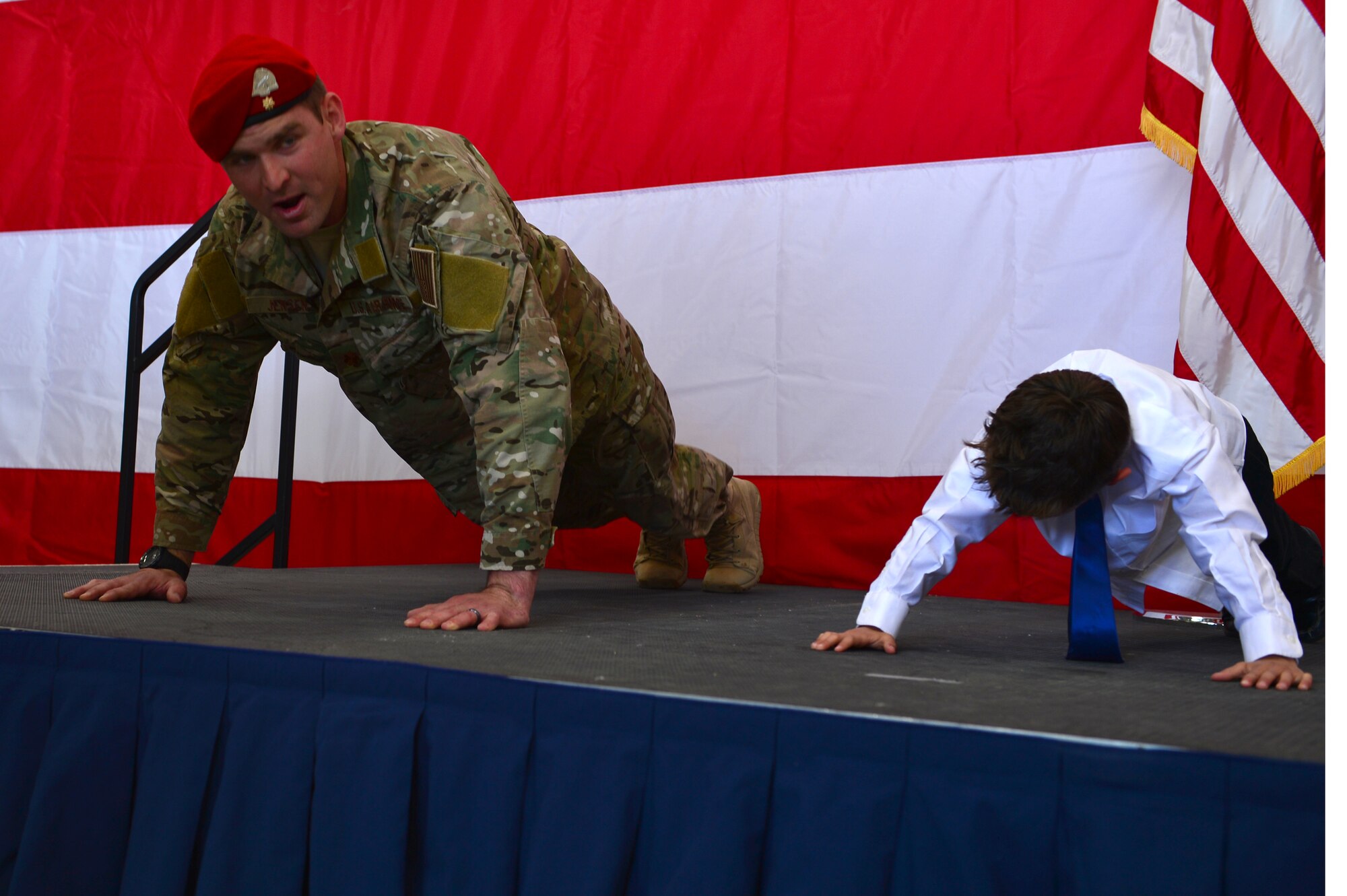 U.S. Air Force Maj. Michael Jensen, 26th Special Tactics Squadron commander, completes memorial pushups during a squadron activation ceremony, April 24, 2014 at Cannon Air Force Base, N.M. The 26 STS, formerly Detachment 1 of the 720th Special Tactics Group, Hurlburt Field, Fla., is a newly activated squadron based at Cannon. (U.S. Air Force photo/ Senior Airman Eboni Reece)