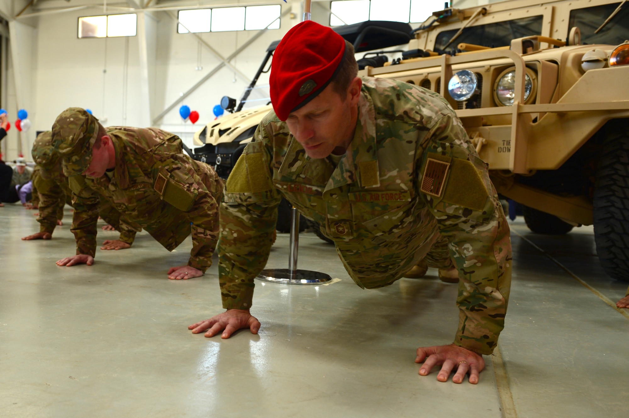 Members of the 26th Special Tactics Squadron complete memorial pushups during a squadron activation ceremony, April 24, 2014 at Cannon Air Force Base, N.M. The 26 STS, formerly Detachment 1 of the 720th Special Tactics Group, Hurlburt Field, Fla., is a newly activated squadron based at Cannon. (U.S. Air Force photo/ Senior Airman Eboni Reece)