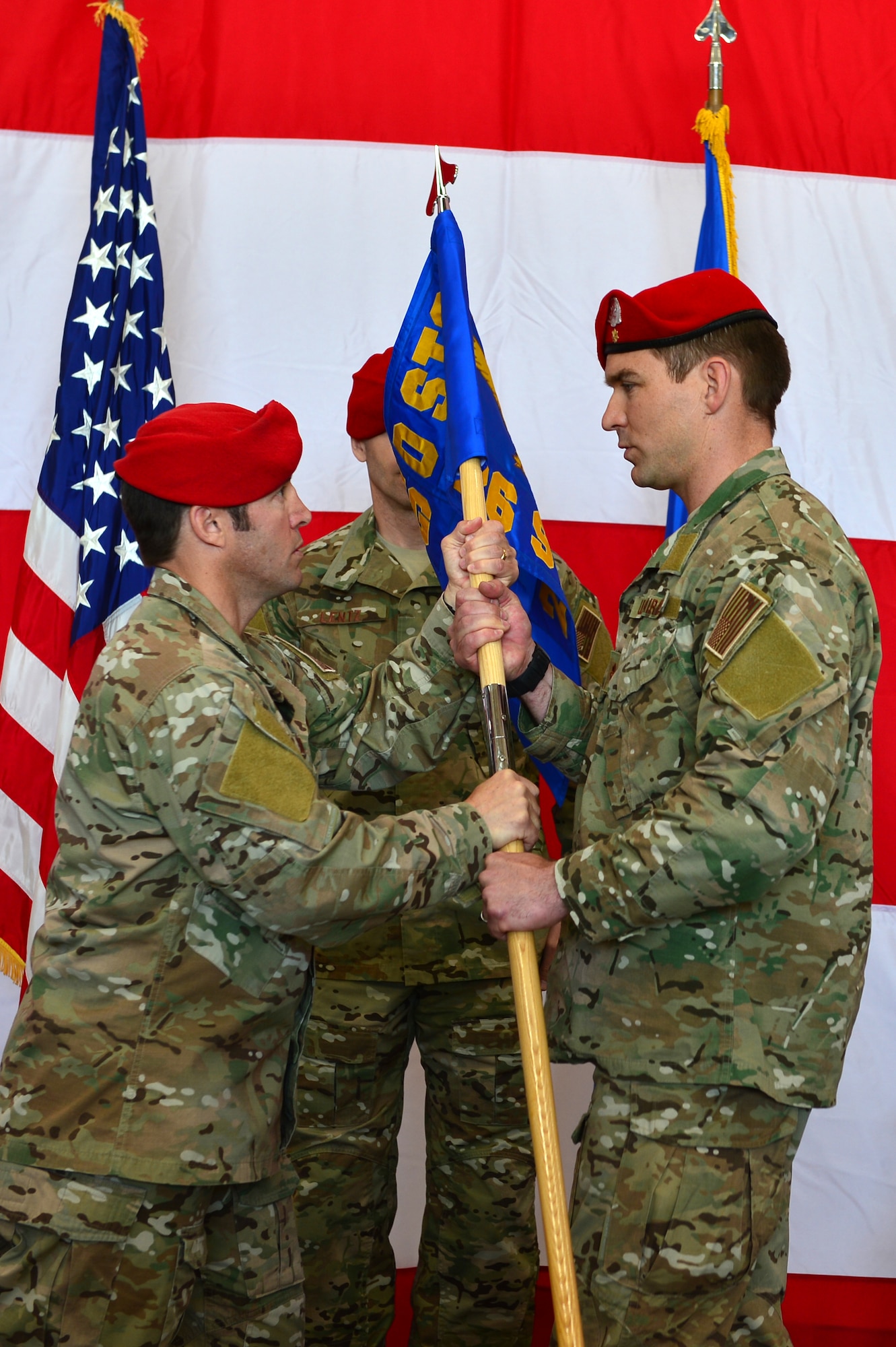 U.S. Air Force Col. Kurt Buller, 720th Special Tactics Group commander, passes the guidon to Maj. Michael Jensen, 26th Special Tactics Squadron commander, during a squadron activation ceremony, April 24, 2014 at Cannon Air Force Base, N.M. The 26 STS, formerly Detachment 1 of the 720th Special Tactics Group, Hurlburt Field, Fla., is a newly activated squadron based at Cannon. (U.S. Air Force photo/ Senior Airman Eboni Reece)