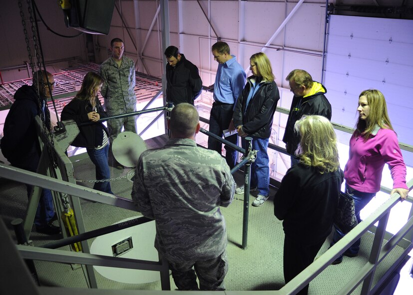 Chief Master Sgt. Philip Lemaitre, 341st Maintenance Operations Squadron member (front center), talks to members of Leadership Great Falls about entering a launch facility at the T-41 maintenance trainer April 17. Their visit to the trainer was part of Leadership Great Falls’ tour of Malmstrom Air Force Base. (U.S. Air Force photo/Senior Airman Cortney Paxton)