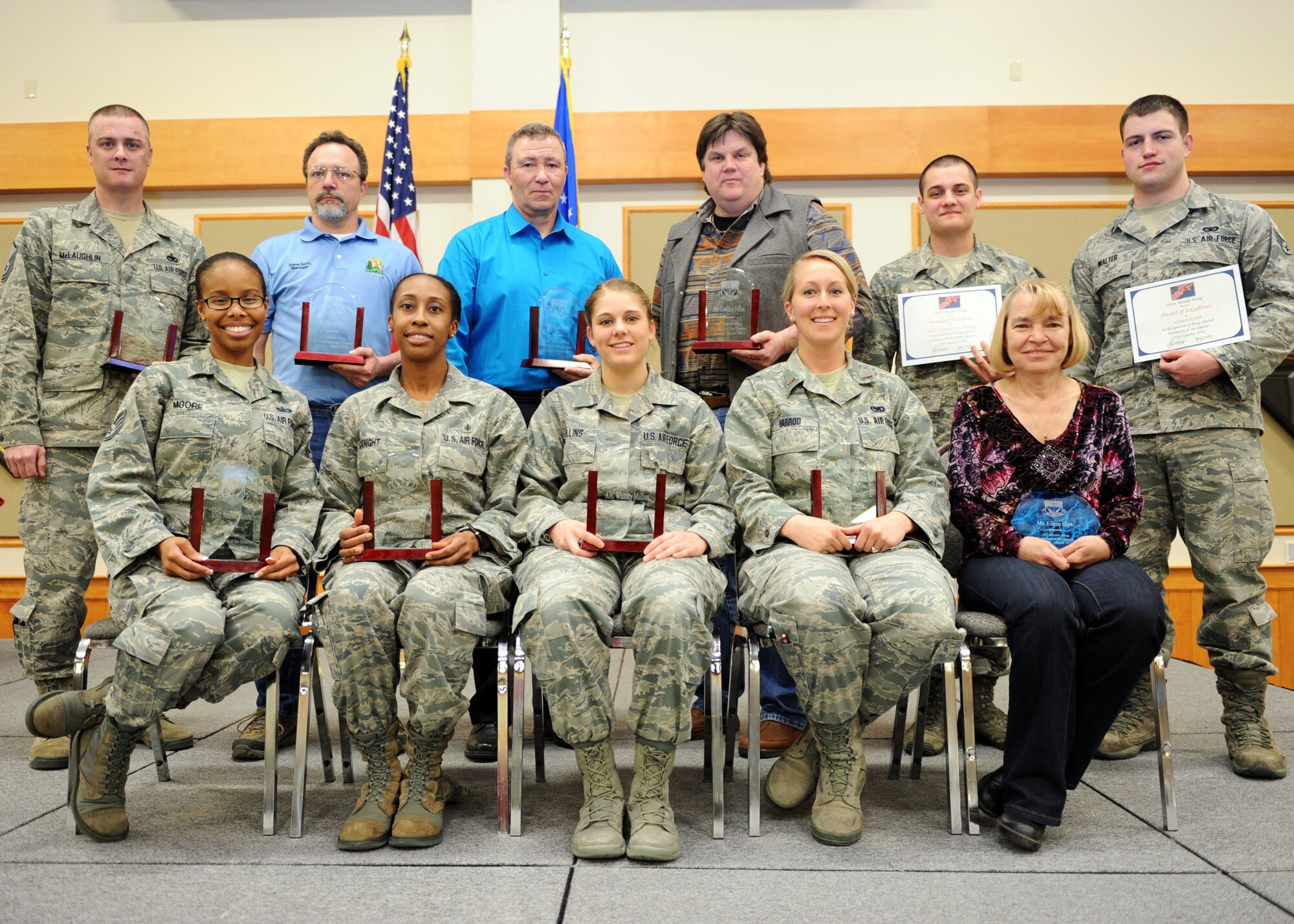 Winners of the first quarter Wing Quarterly Awards pose for a photo at the Grizzly Bend on April 18. Pictured from left to right are: (back row) Senior NCO of the Quarter, Master Sgt. Mark McLaughlin, 341st Operations Support Squadron; Category Two Civilian of the Quarter, Steve Surls, 341st Force Support Squadron; Category One Civilian of the Quarter, Brian Perry, 341st Medical Support Squadron; Category Two Civilian of the Quarter, Geoffrey Fallon, 341st MDSS; Outstanding Dorm Room of the Quarter, Senior Airman Casey Blakeley, 341st Medical Operations Squadron; Outstanding Dormitory of the Quarter representative, Senior Airman Matthew Walter, 741st Missile Security Forces Squadron, Dorm 640. (Front row) Honor Guard Member of the Quarter, Staff Sgt. Amber Moore, 341st FSS; NCO of the Quarter, Tech. Sgt. Tashina McKnight, 341st MDSS; Airman of the Quarter, Airman 1st Class Whitney Mullins, 341st MDSS; Company Grade Officer of the Quarter, 2nd Lt. Layne Harrod, 341st Logistics Readiness Squadron; Civilian Volunteer of the Quarter, Eileen Gort, 341st LRS. Not pictured: Civilian Category 1 Supervisor of the Quarter, Curtis Hester, 341st Civil Engineer Squadron. Professional Team of the Quarter, 341st CES flood pump team. (U.S. Air Force photo/Senior Airman Katrina Heikkinen)