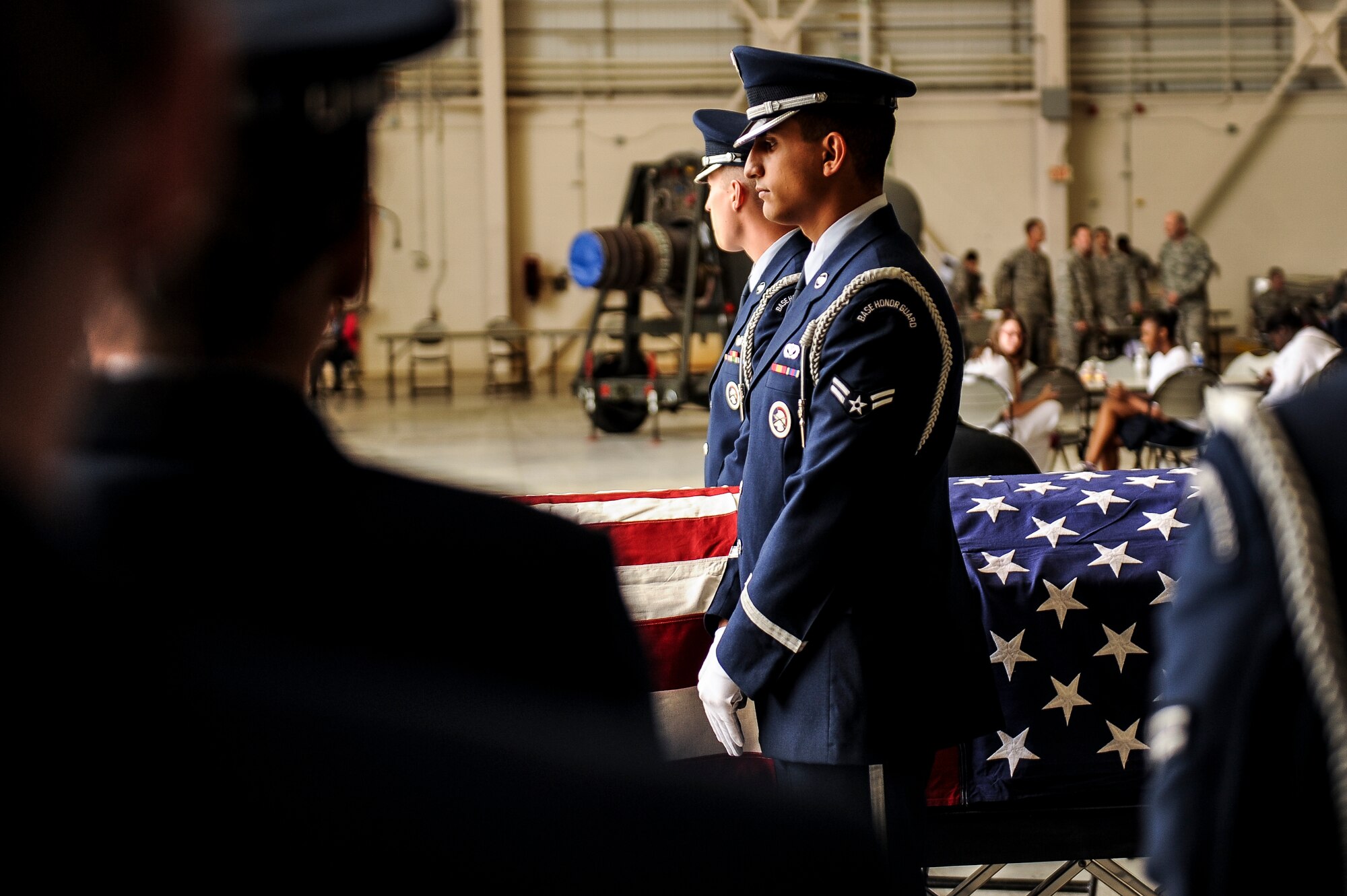Little Rock Air Force Base honor guardsmen stand at ceremonial at ease before they perform a demonstration of an official military funeral service during Little Rock Air Force Base’s Junior Reserve Officer Training Corps Expo, April 17, 2014. The annual Little Rock AFB Junior ROTC Expo is a consolidated career day that represents an overview of Team Little Rock’s mission. (U.S. Air Force photo by Airman 1st Class Cliffton Dolezal)