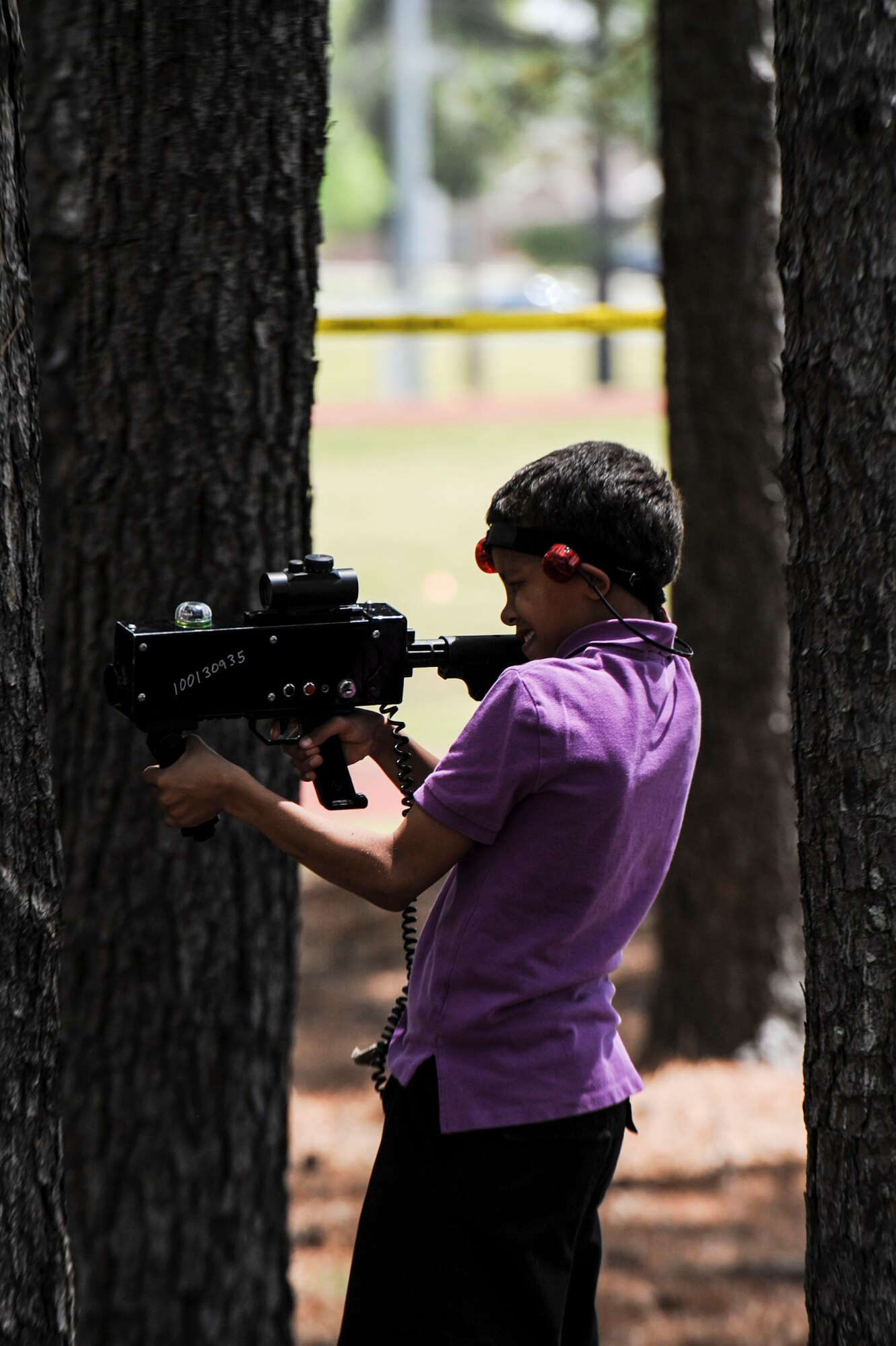 Cameron enjoys a game of laser tag during Family Fest April 18, 2014, at Little Rock Air Force Base, Ark. The Outdoor Adventure Center provided the laser tag kit for children to enjoy throughout the day. (U.S. Air Force photo by Staff Sgt. Jessica Condit)