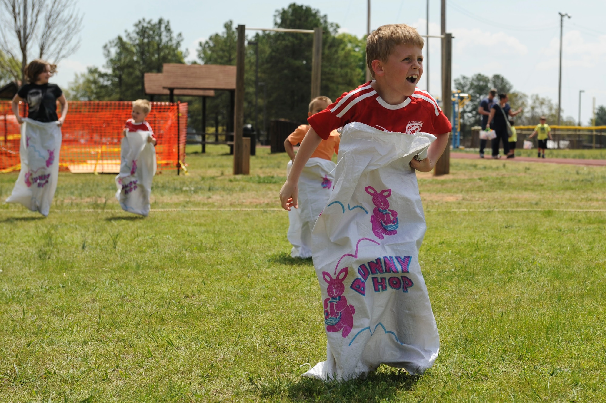 Coleman, a guest at the Family Fest, participates in a sack race April 18, 2014, at Little Rock Air Force Base, Ark. Family Fest provided many activities for children of all ages to include Easter egg hunts, sack races and miniature golf. (U.S. Air Force photo by Staff Sgt. Jessica Condit)