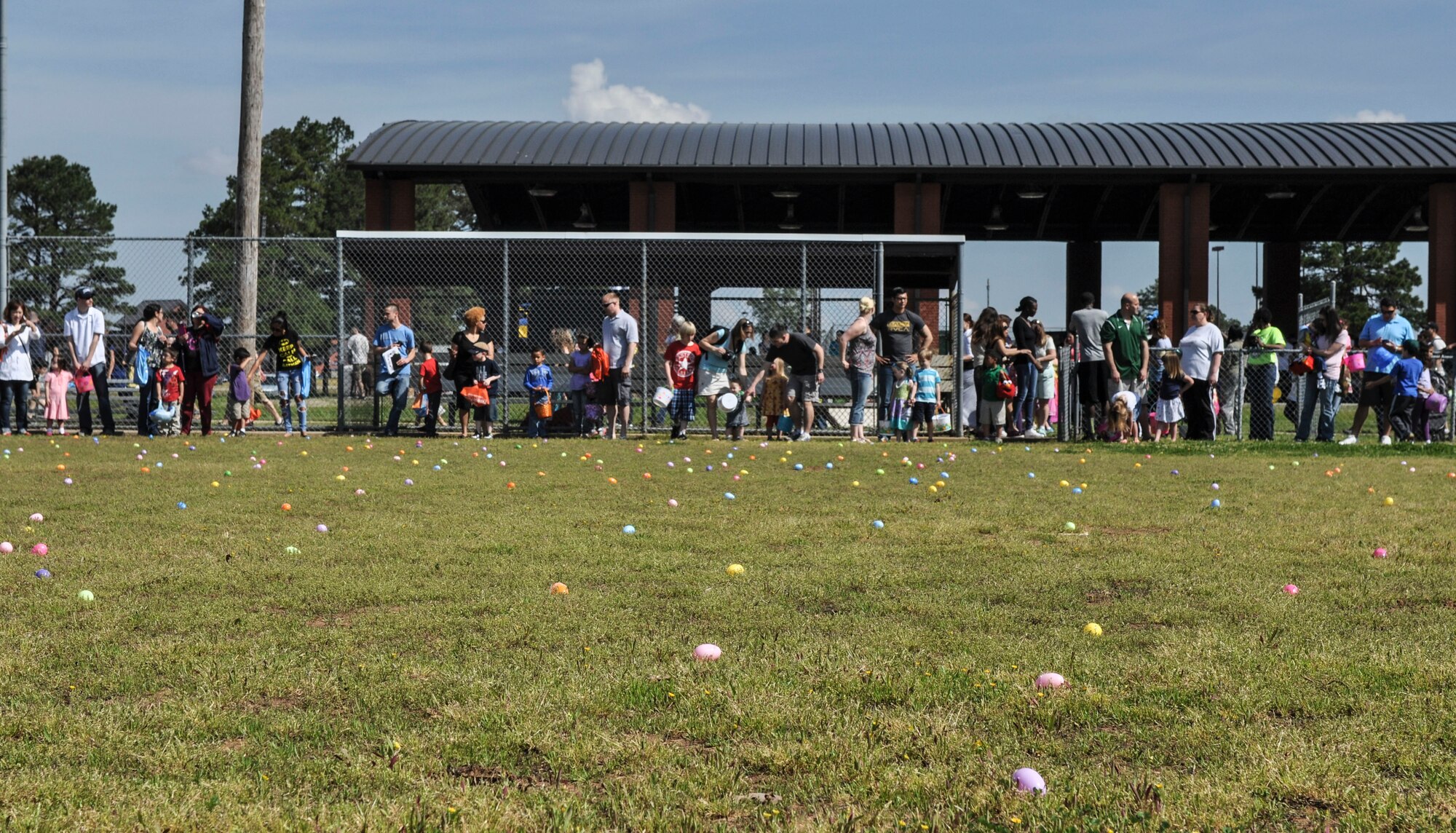 Exceptional family members line the fence and wait for the start of one of many Easter egg hunts April 19, 2014, during Family Fest at Little Rock Air Force Base, Ark. More than five age-group-specific Easter egg hunts were held during the event. (U.S. Air Force photos by Senior Airman Regina Agoha
