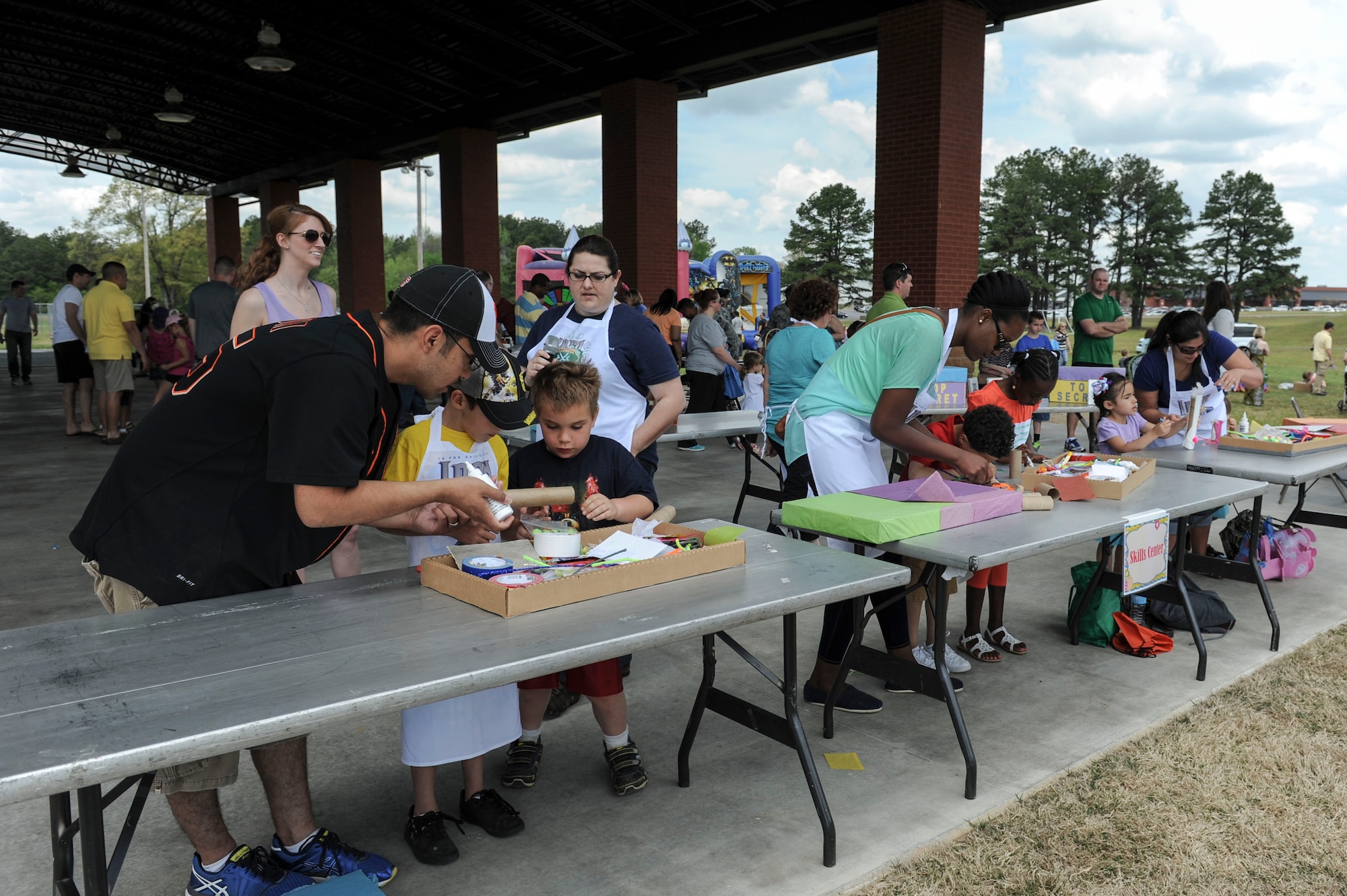 Famillies participate in the Iron Crafter competition hosted by the skills center during Family Fest April 18 at Little Rock Air Force Base. The competition was a team building exercise, encouraging famillies to work together to accomplish a craft project. (U.S. Air Force photo by Staff Sgt. Jessica Condit)