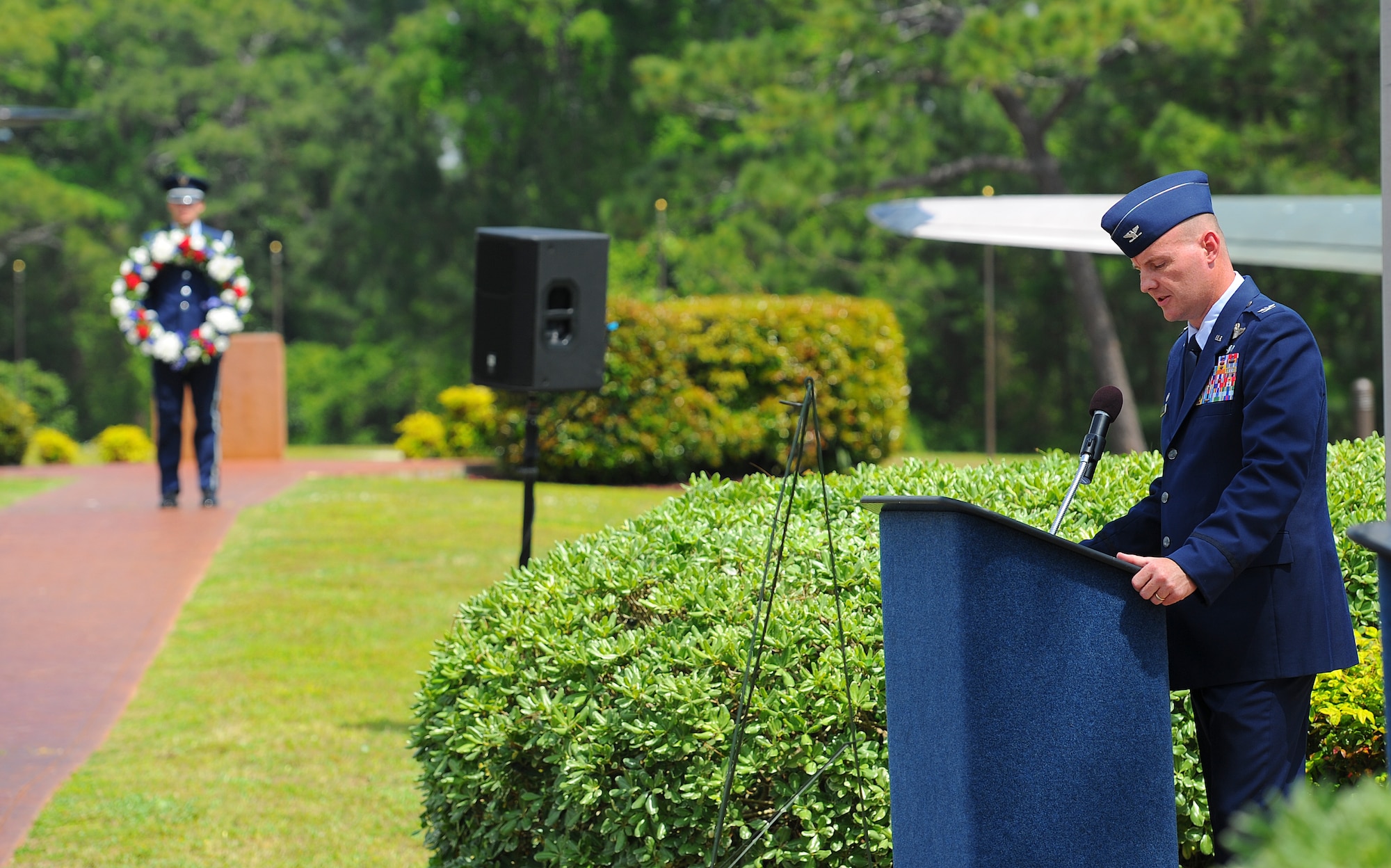 Col. Shawn Cameron, 1st Special Operations Group commander, speaks at the Operation Eagle Claw ceremony at the air park on Hurlburt Field, Fla., April 24, 2014. As U.S. forces prepared to abort Operation Eagle Claw, one of the helicopters crashed into a transport aircraft, which contained both service members and jet fuel. The resulting fire killed eight service members and destroyed the aircraft. (U.S. Air Force photo/Airman 1st Class Jeff Parkinson)