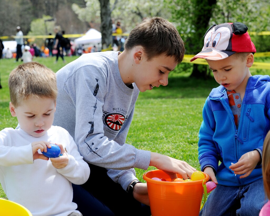The Paudler children eat candy from their Easter eggs during the Annual Family Fest and Eggs and Bunnies Celebration at Joint Base Andrews, Md., April 19, 2014. More than 600 Team Andrews members attend the festival, and the celebration boasted numerous events including an Easter egg hunt, pictures with the Easter bunny, inflatable bounce houses, food, a “Kids Run” and more. (U.S. Air Force photo/ Staff Sgt. Nichelle Anderson)