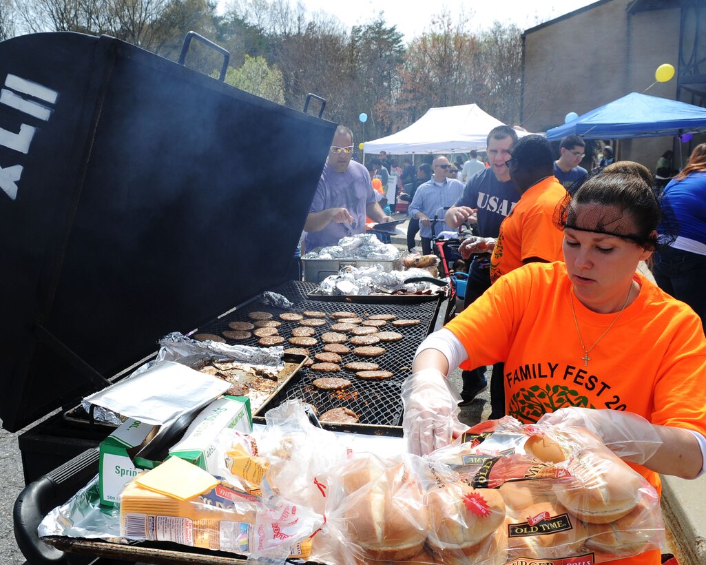 Youth Center staff and volunteers grill food during the Annual Family Fest and Eggs and Bunnies Celebration at Joint Base Andrews, Md., April 19, 2014. More than 600 Team Andrews members attend the festival, and the celebration boasted numerous events including an Easter egg hunt, pictures with the Easter bunny, inflatable bounce houses, food, a “Kids Run” and more. (U.S. Air Force photo/ Staff Sgt. Nichelle Anderson)
