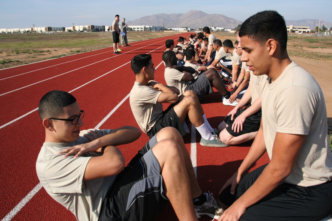 Development Training Flight trainees stretch on the new track in preparation for a physical fitness test on Feb. 8, 2013. The trainees here, attend one Unit Training Assembly per month to prepare for Basic Military Training by focusing on various areas, including, but not limited to, Air Force history, customs and courtesies, physical fitness and memory work. (U.S. Air Force photo/Senior Airman Russell S. McMillan)