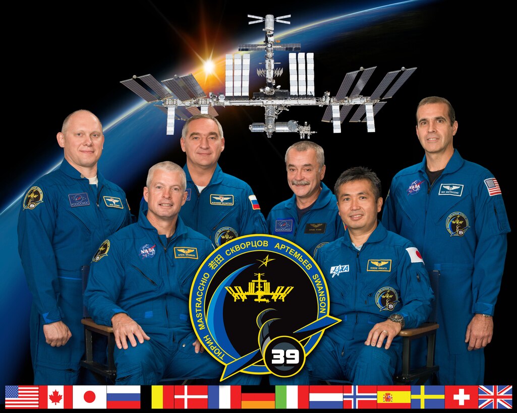 Expedition 39, ISS039-S-002, crew members take a break from training to pose for a crew portrait at NASA's Johnson Space Center, Houston, Texas, July 12, 2013. Pictured on the front row is Japan Aerospace Exploration Agency astronaut Koichi Wakata (right), commander, and NASA astronaut Steve Swanson, flight engineer. Pictured from the left (back row) are Russian cosmonauts and flight engineers Oleg Artemyev, Alexander Skvortsov, Mikhail Tyurin and NASA astronaut Rick Mastracchio. (NASA-JSC photo/ Bill Stafford)