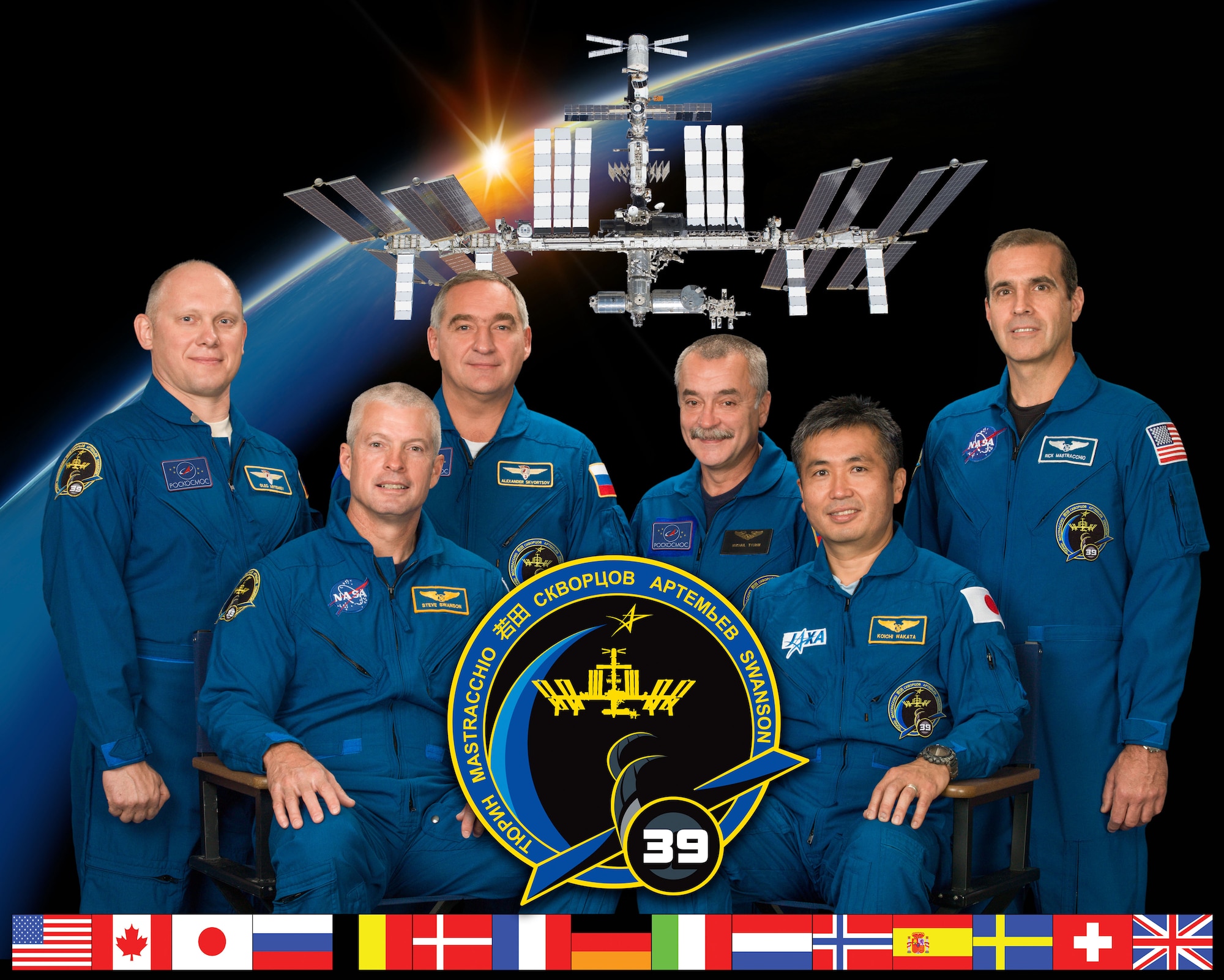 Expedition 39, ISS039-S-002, crew members take a break from training to pose for a crew portrait at NASA's Johnson Space Center, Houston, Texas, July 12, 2013. Pictured on the front row is Japan Aerospace Exploration Agency astronaut Koichi Wakata (right), commander, and NASA astronaut Steve Swanson, flight engineer. Pictured from the left (back row) are Russian cosmonauts and flight engineers Oleg Artemyev, Alexander Skvortsov, Mikhail Tyurin and NASA astronaut Rick Mastracchio. (NASA-JSC photo/ Bill Stafford)