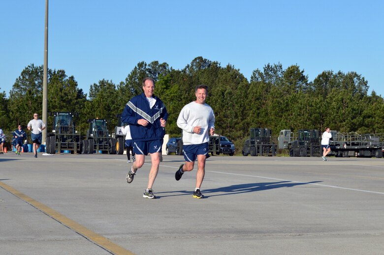 Brig. Gen. James Scanlan, 440th Airlift Wing commander, left, and Col. Daniel Tulley, 43rd Airlift Group commander, participate in Team Pope’s sexual assault awareness month 5K fun run on April 24, Pope Army Airfield, N.C. (U.S. Air Force photo/Marvin Krause)

