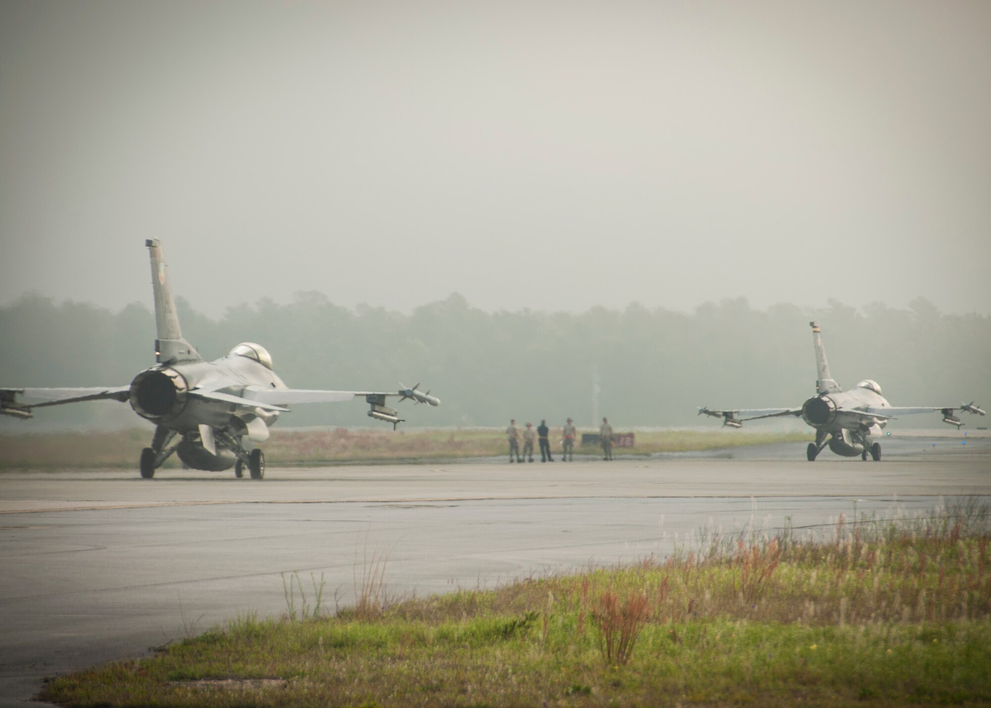 Two F-16s get into position for their flight with the F-35 as part of immersion training at Eglin Air Force Base, Fla., today. (U.S. Air Force photo/Senior Airman Crystal Charriere)