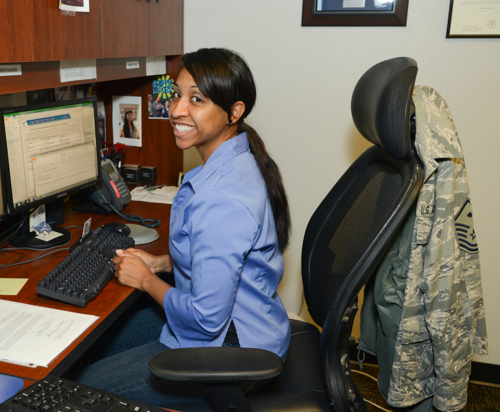 Master Sgt. Olypia Williamson, 1st Sgt.,136th Airlift Wing, works on her computer while wearing jeans in observance of 'Denim Day', a campaign observed annually on April 23 for the awareness of sexual assault prevention and response  at Naval Air Station Fort Worth Joint Reserve Base, Texas, April 23, 2014. This occasion marks the last event of the Sexual Assault Awareness Month in the Wing. (U.S. Air National Guard photo by Senior Master Sgt. Elizabeth Gilbert/Released)