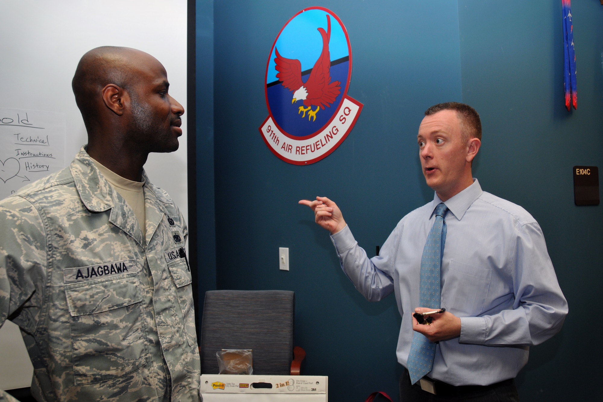 Jason Gunnarson, community readiness consultant, and Master Sgt. Ajagbawa, 916th Command Post, discuss personality activity results during a Four Lenses seminar at Seymour Johnson AFB in April. (U.S. Air Force photo by Staff Sgt. Terrica Y. Jones, 916th ARW/PA)