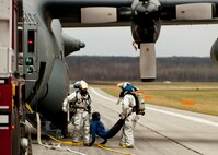 910th Airlift Wing firefighters remove a simulated victim from a C-130 Hercules aircraft during a Major Accident Readiness Exercise (MARE) here, April 23, 2014. In the exercise scenario, a C-130 aircraft’s landing gear collapsed while landing on the assault strip. Debris from the aircraft hit a private aircraft taxiing nearby. Base emergency response personnel tested their response capability while Wing Inspection Team (WIT) members observed.  U.S. Air Force photo/Eric M. White.