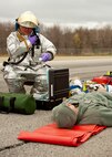 A 910th Airlift Wing firefighter radios victim statuses to response coordinators during a Major Accident Readiness Exercise (MARE) here, April 23, 2014. In the exercise scenario, a C-130 aircraft’s landing gear collapsed while landing on the assault strip. Debris from the aircraft hit a private aircraft taxiing nearby. Base emergency response personnel tested their response capability while Wing Inspection Team (WIT) members observed. U.S. Air Force photo/Eric M. White.