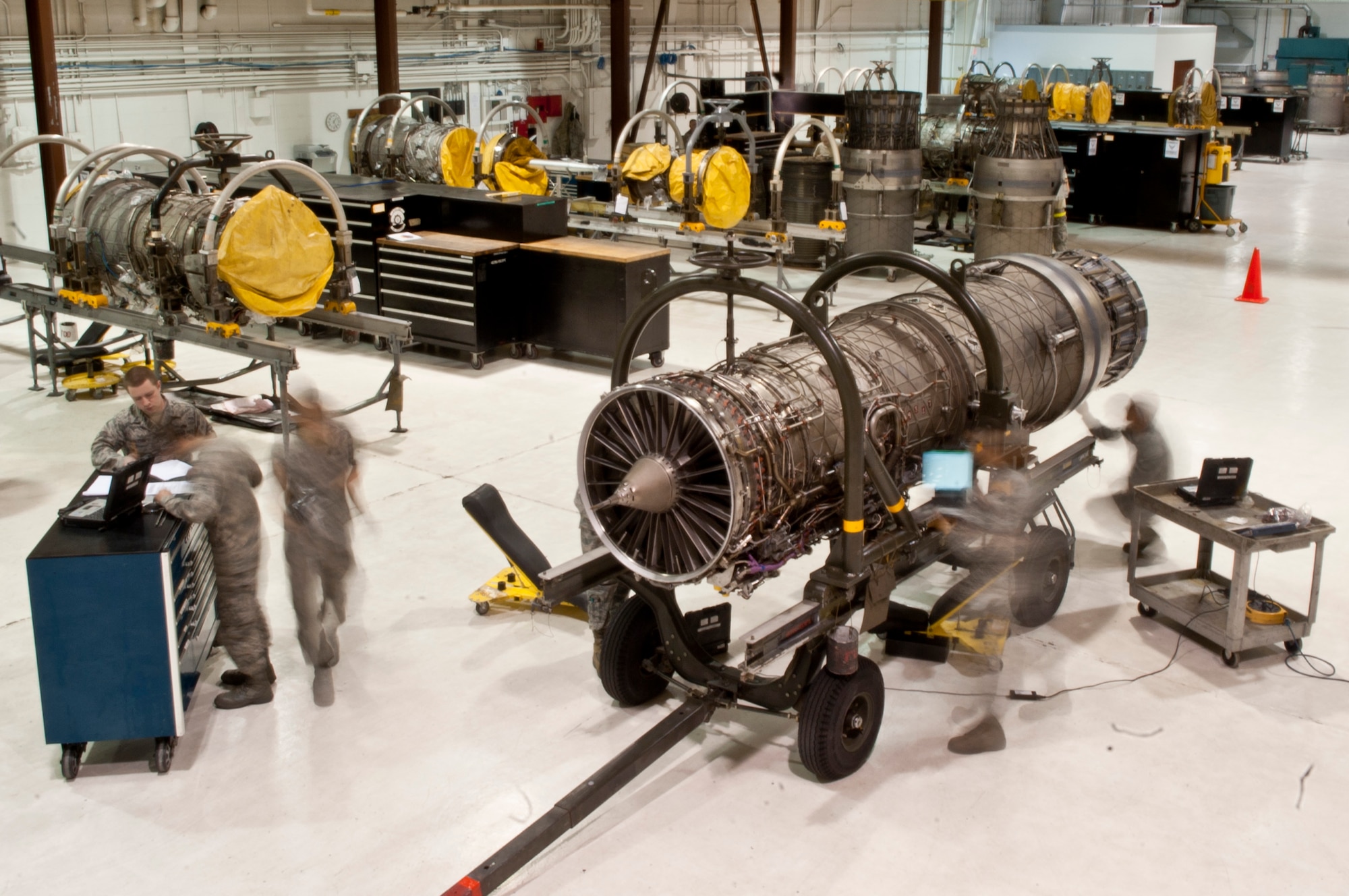 Airmen from the 4th Components Maintenance Squadron propulsion flight conduct routine maintenance on an F-15E Strike Eagle engine, April 10, 2014, at Seymour Johnson Air Force Base, N.C. The propulsion flight is responsible for supplying war-ready engines in support of more than 90 F-15E aircraft by inspecting, tearing down, and building the engines. (U.S. Air Force photo/Airman 1st Class Shawna L. Keyes)