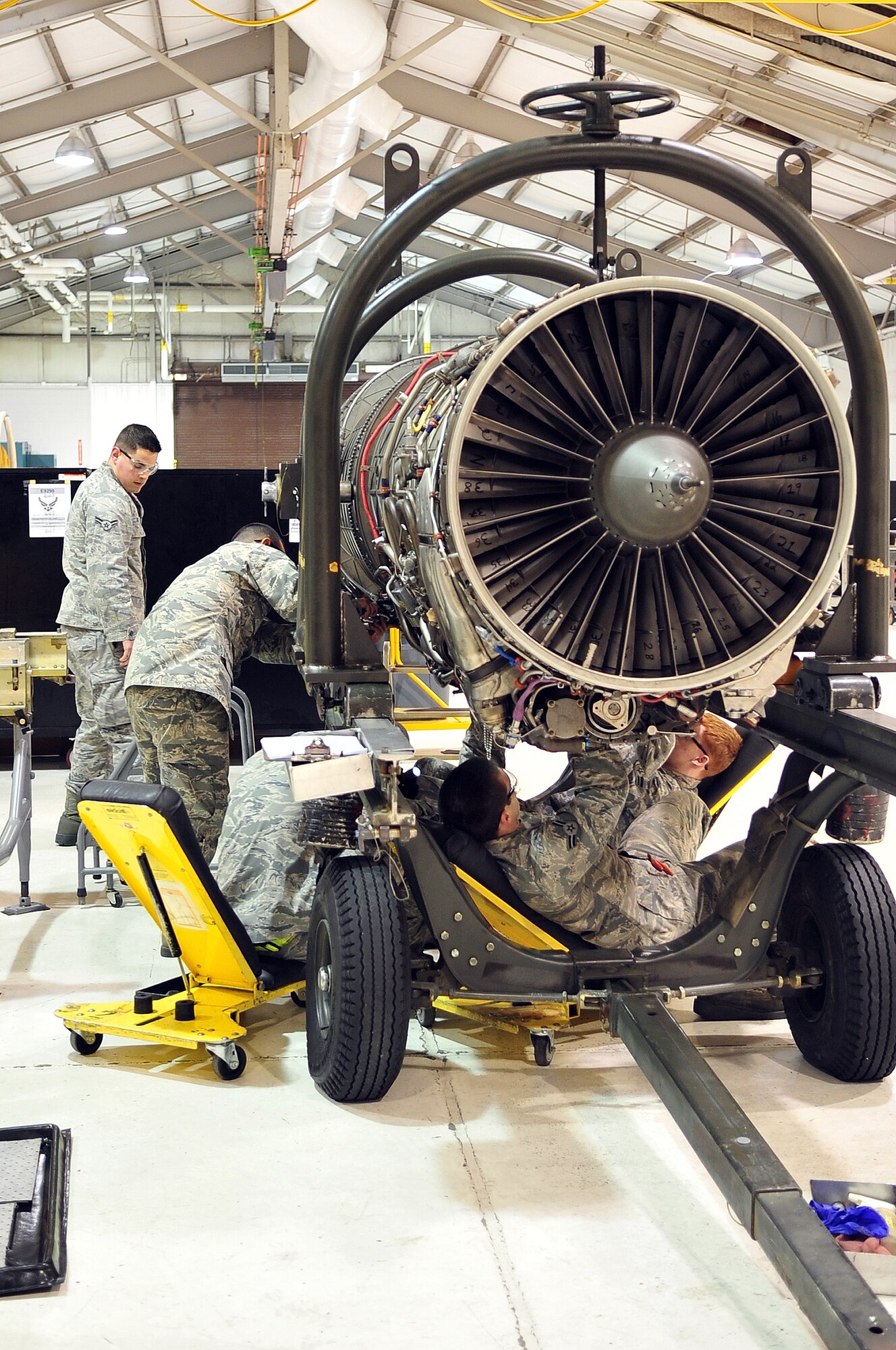 Airmen from the 4th Component Maintenance Squadron propulsion flight conduct routine maintenance on an F-15E Strike Eagle engine, April 10, 2014, at Seymour Johnson Air Force Base, N.C. The 4th CMS propulsion flight boasts the largest propulsion flight in the Air Force in terms of the number of engines maintained by the flight, totaling more than 200. (U.S. Air Force photo/Airman 1st Class Shawna L. Keyes)