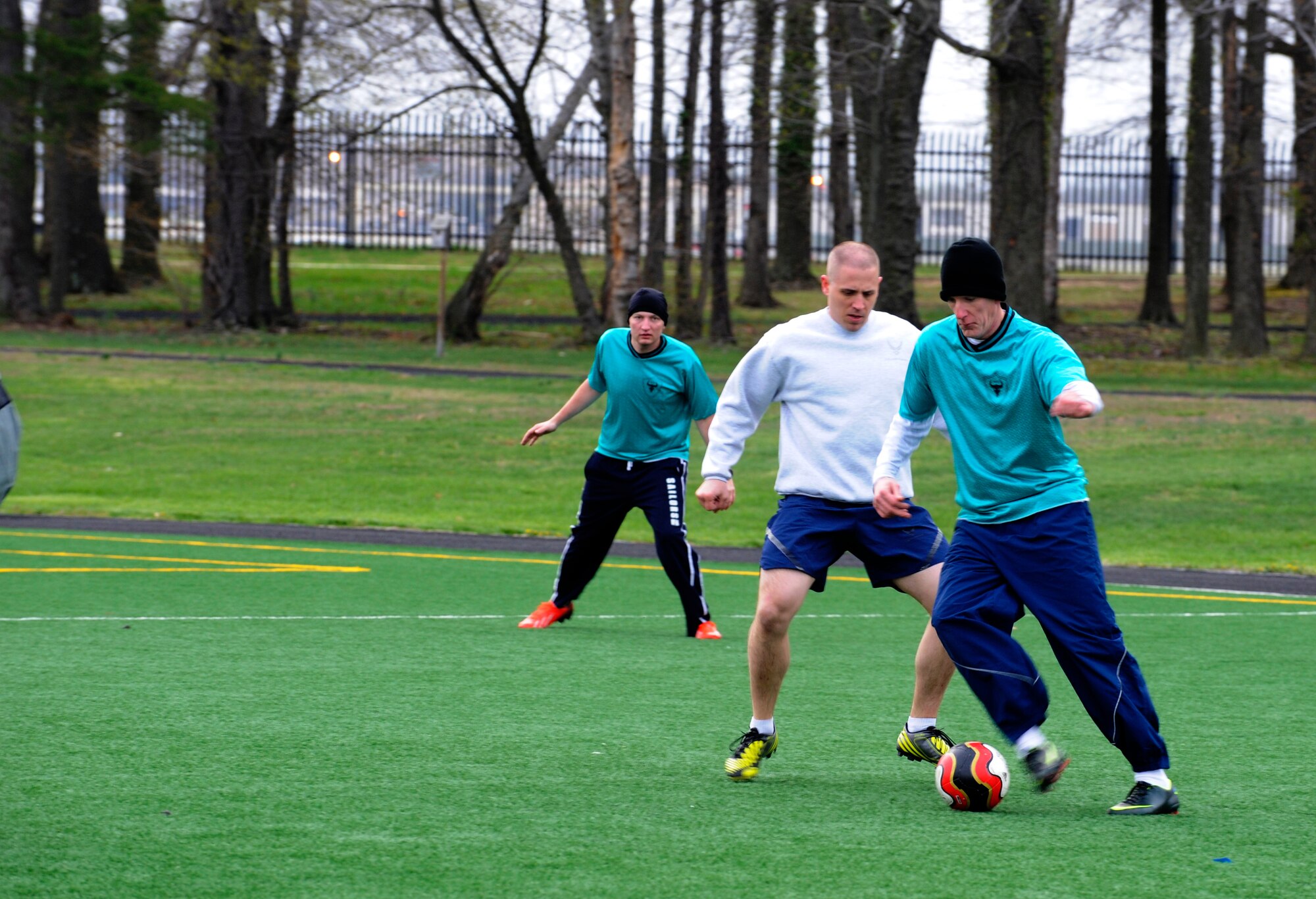 Staff Sgt. Frank Murphy moves down the field during a scrimmage April 18, 2014, at Joint Base Andrews, Md. The Civil Engineer Futbol Club meets every Friday morning during physical training and sometimes after work to practice their skills, relieve stress, build camaraderie, and get a workout. (U.S. Air Force photo by Senior Airman Mariah Haddenham/ Released)