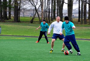 Staff Sgt. Frank Murphy moves down the field during a scrimmage April 18, 2014, at Joint Base Andrews, Md. The Civil Engineer Futbol Club meets every Friday morning during physical training and sometimes after work to practice their skills, relieve stress, build camaraderie, and get a workout. (U.S. Air Force photo by Senior Airman Mariah Haddenham/ Released)